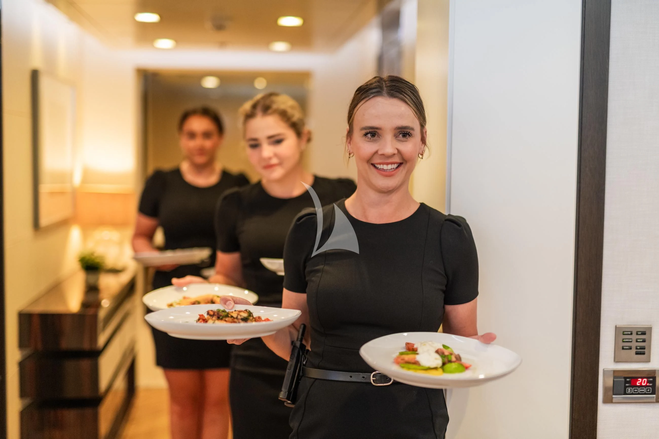 a group of women holding plates aboard HOLDIN' MY OWN Yacht for Sale