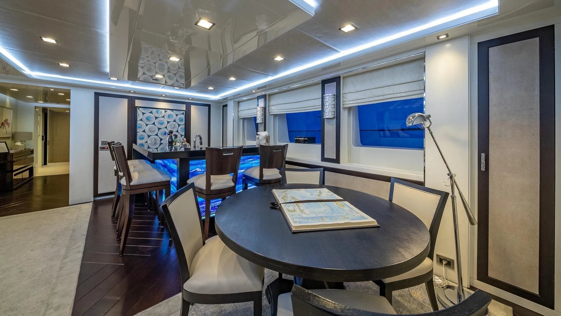 a conference room with a table and chairs aboard HOLDIN' MY OWN Yacht for Sale