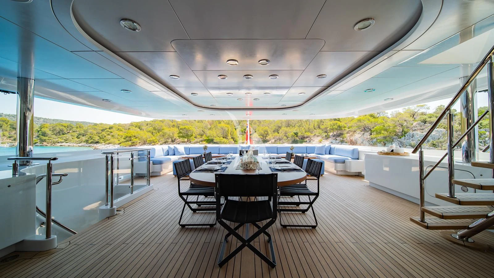 a large room with a table and chairs aboard HOLDIN' MY OWN Yacht for Sale