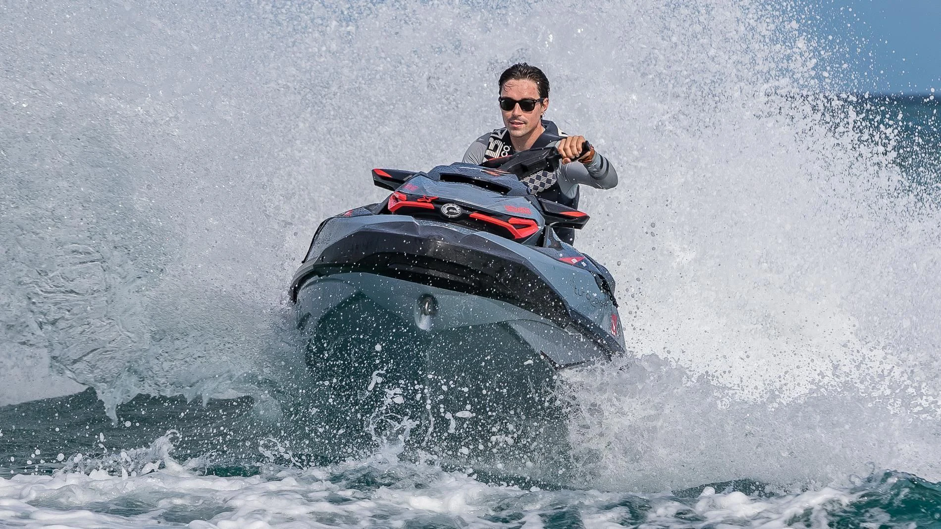 a man driving a jet ski aboard HOLDIN' MY OWN Yacht for Sale