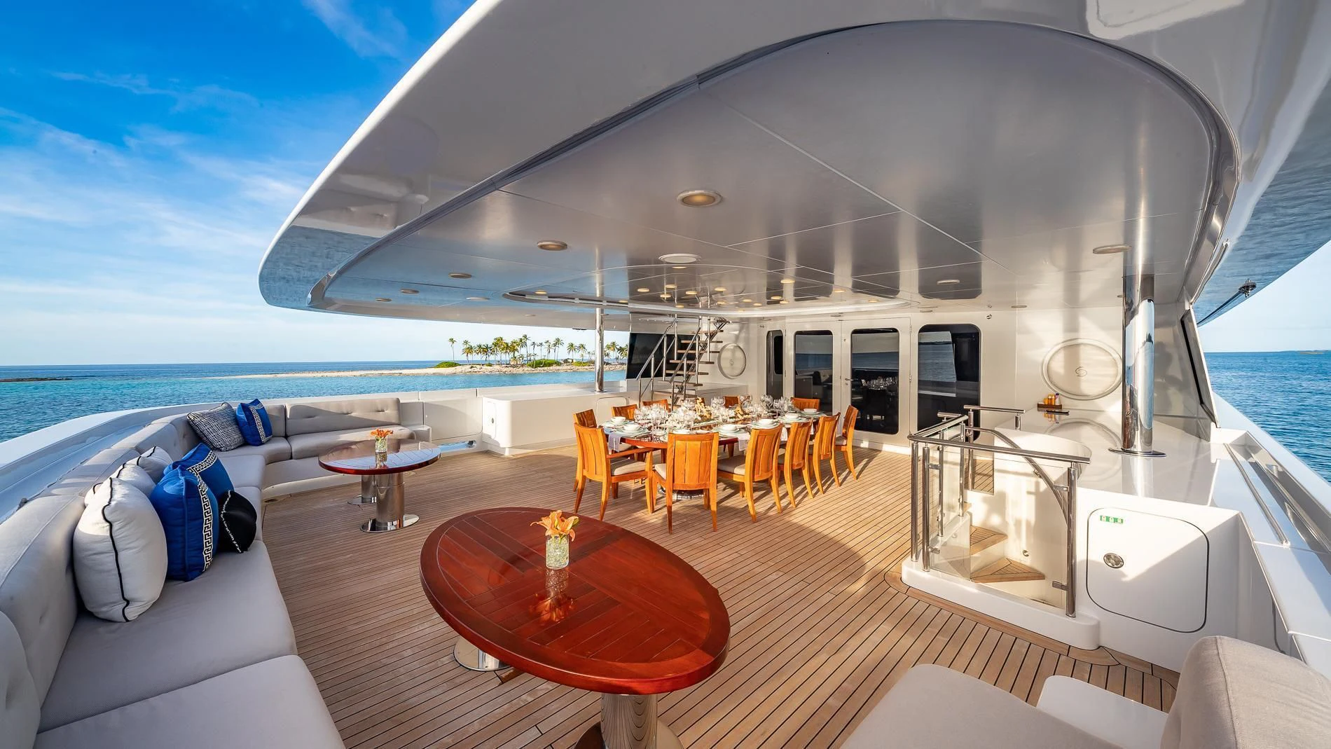 a large living room with a large balcony overlooking the ocean aboard HOLDIN' MY OWN Yacht for Sale