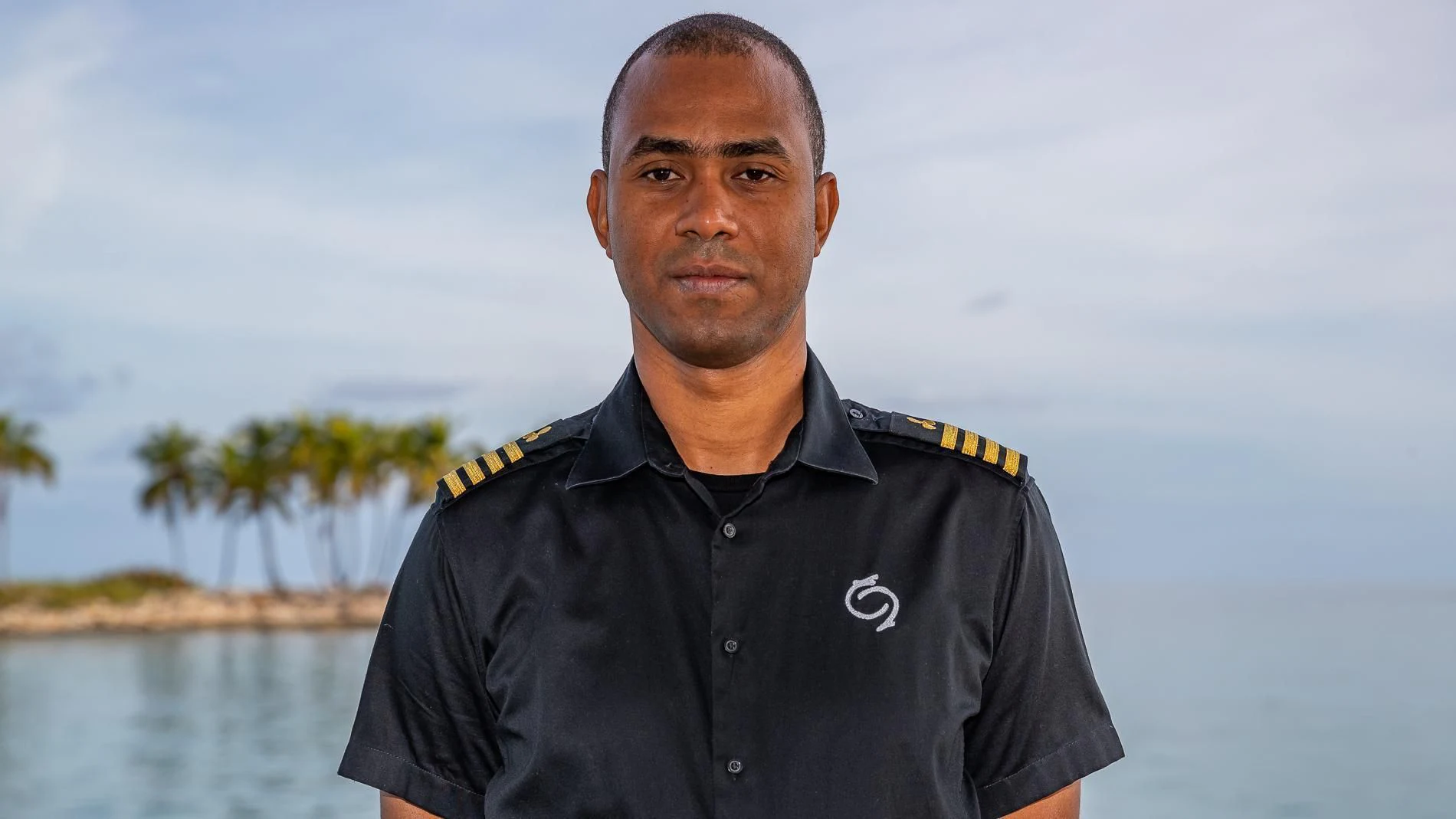 a man in a black shirt aboard HOLDIN' MY OWN Yacht for Sale