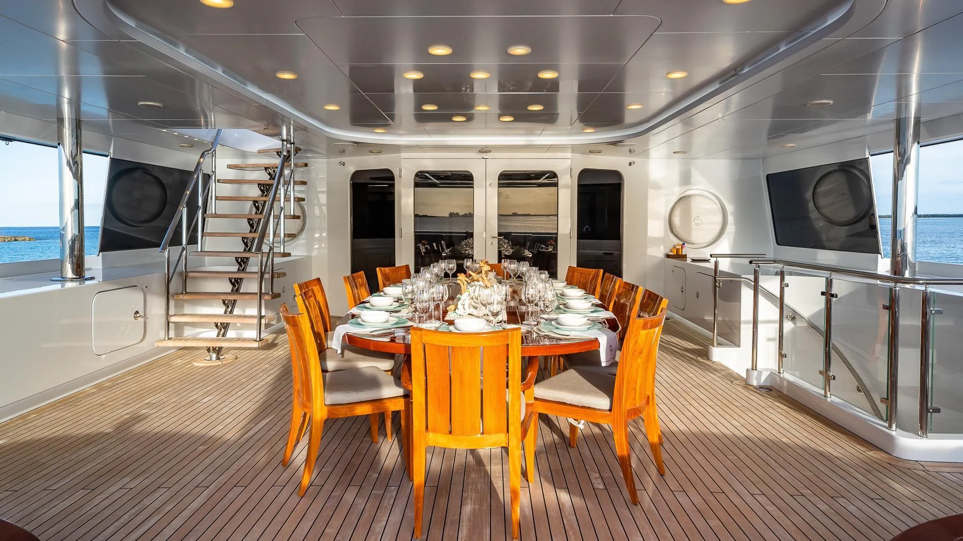 a dining room with a table and chairs aboard HOLDIN' MY OWN Yacht for Sale