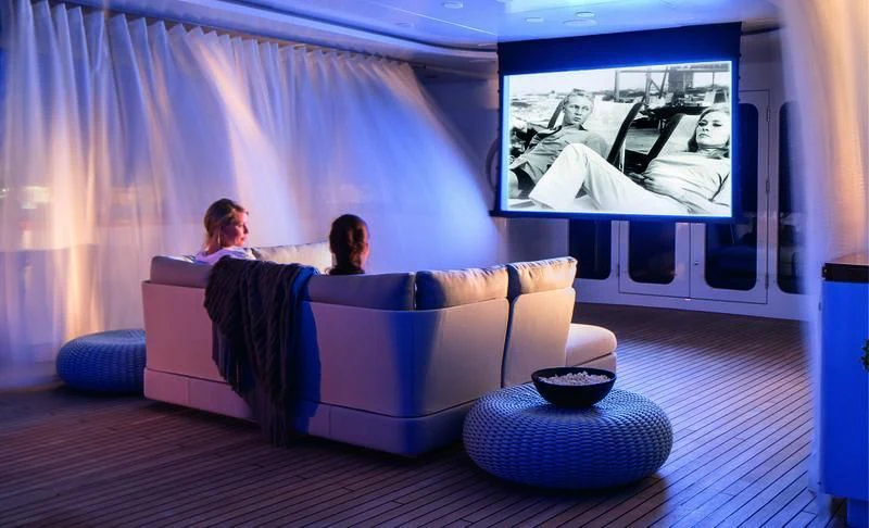 a couple of people sitting on a couch watching a tv aboard HOLDIN' MY OWN Yacht for Sale