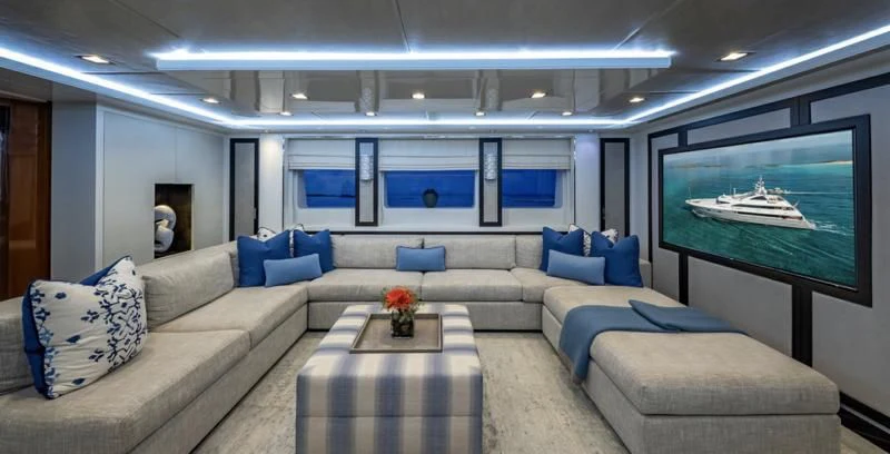 a living room with a large screen aboard HOLDIN' MY OWN Yacht for Sale
