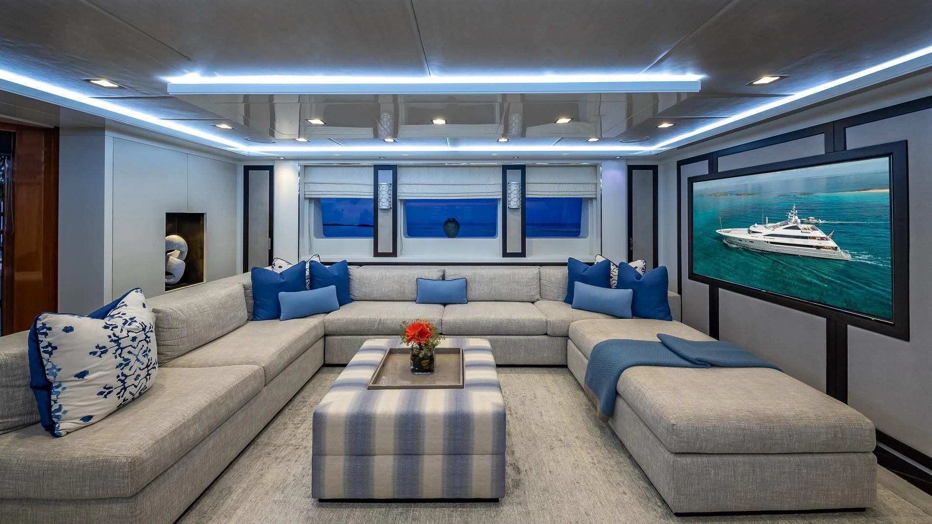 a living room with a large screen aboard HOLDIN' MY OWN Yacht for Sale