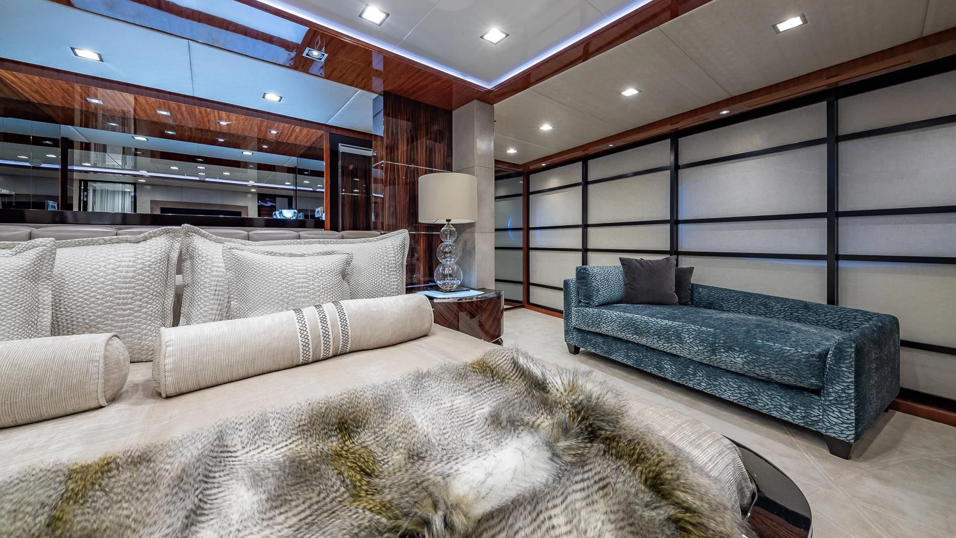 a living room with a couch and a large mirror aboard HOLDIN' MY OWN Yacht for Sale
