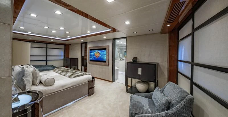 a bedroom with a bed and a tv aboard HOLDIN' MY OWN Yacht for Sale
