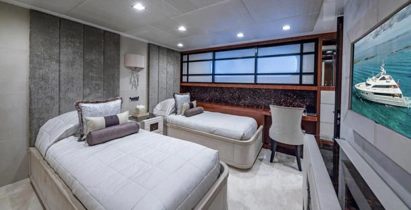 a room with a bed and a chair aboard HOLDIN' MY OWN Yacht for Sale