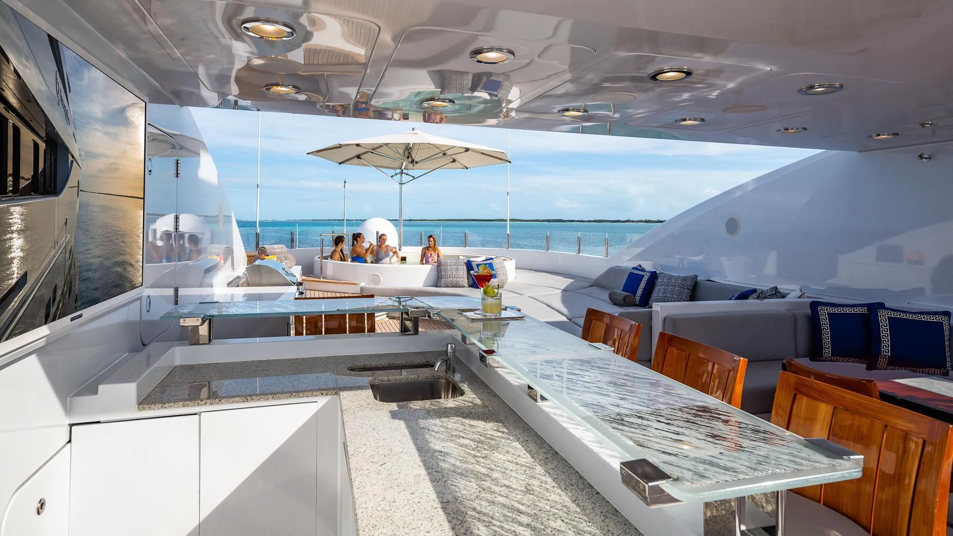 a room with tables and chairs aboard HOLDIN' MY OWN Yacht for Sale