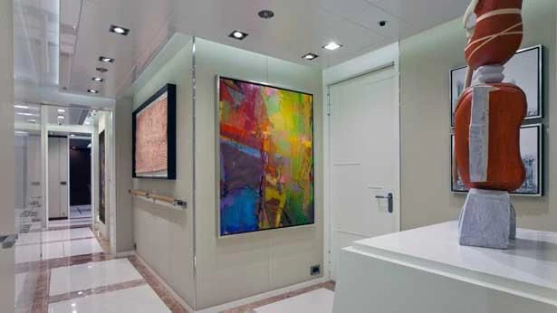 a room with paintings on the wall aboard HOLDIN' MY OWN Yacht for Sale