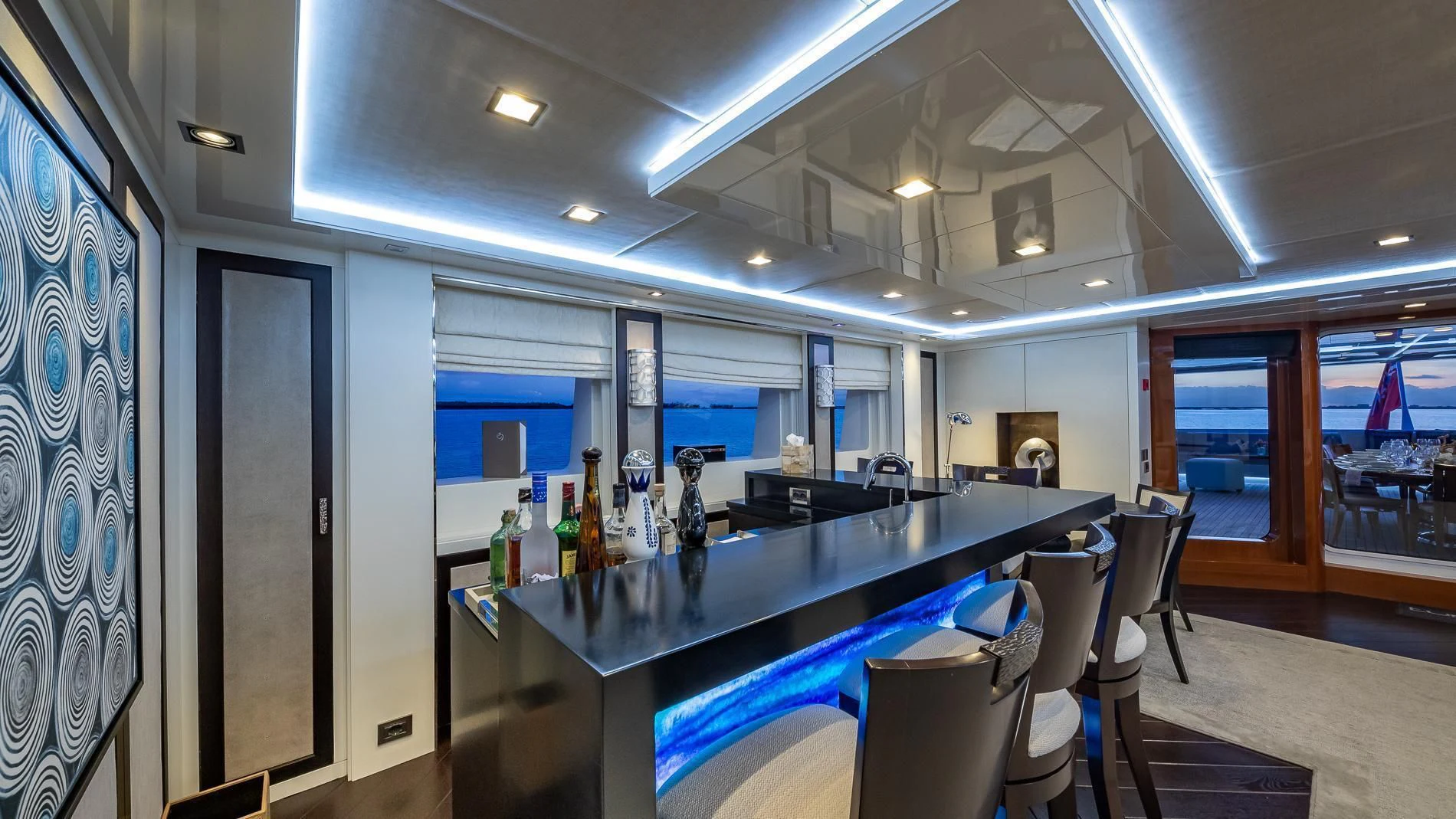 a bar with a table and chairs aboard HOLDIN' MY OWN Yacht for Sale
