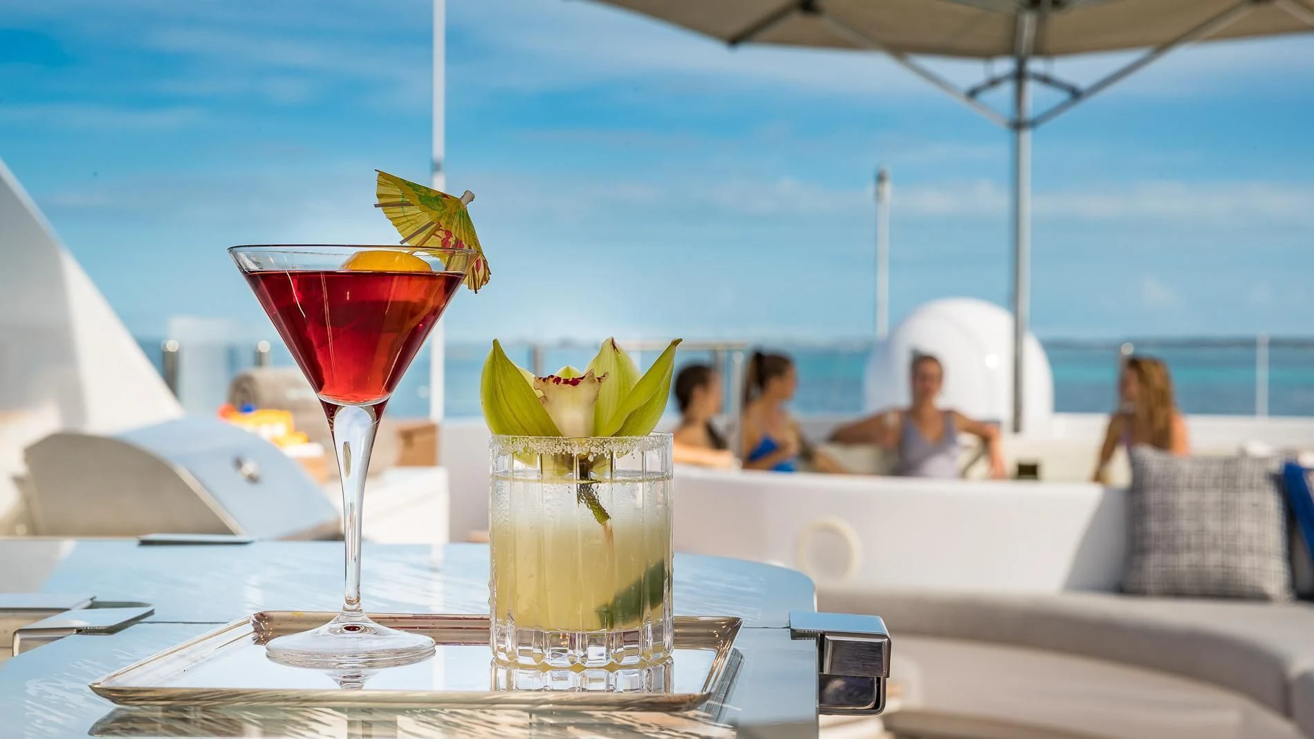 a couple of drinks on a table aboard HOLDIN' MY OWN Yacht for Sale