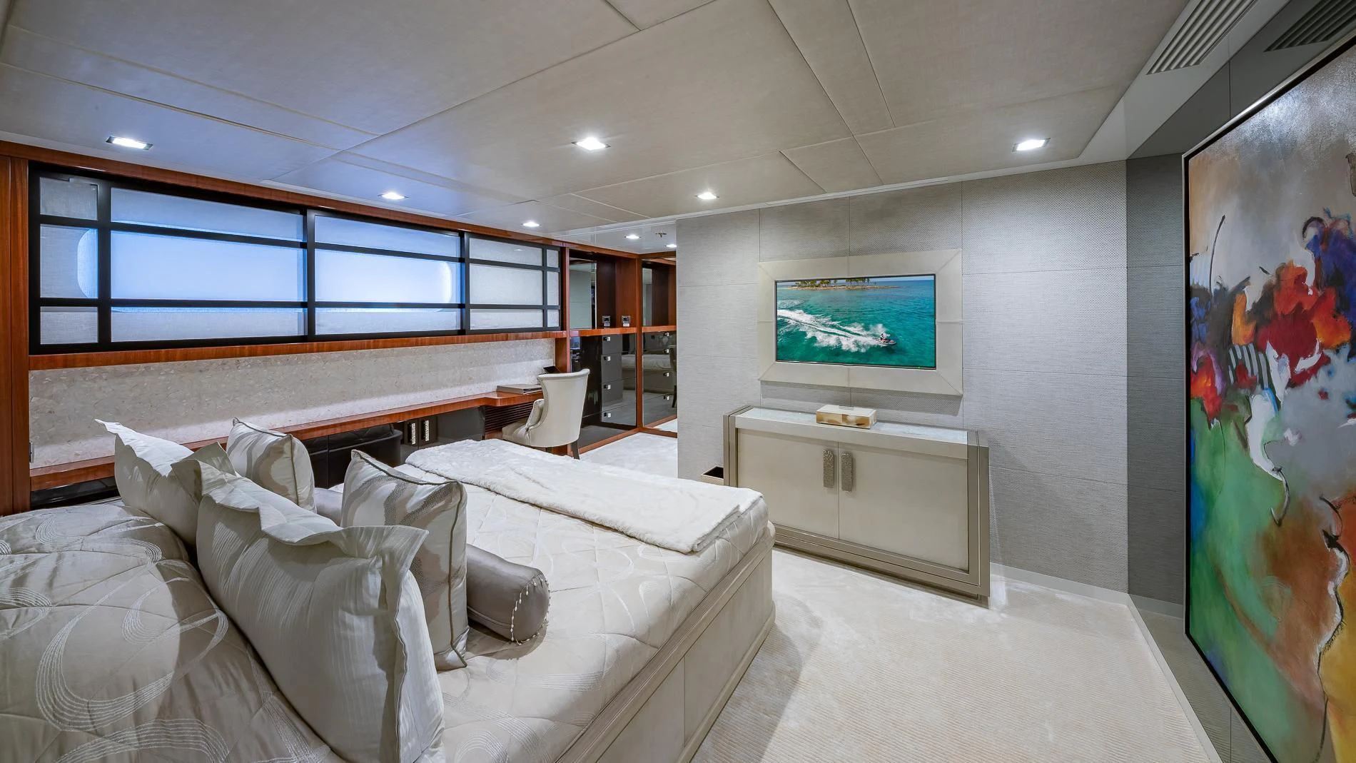 a room with a large bed and a tv on the wall aboard HOLDIN' MY OWN Yacht for Sale