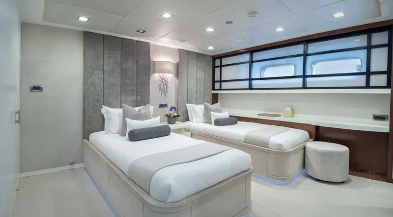 a room with a bed and a window aboard HOLDIN' MY OWN Yacht for Sale