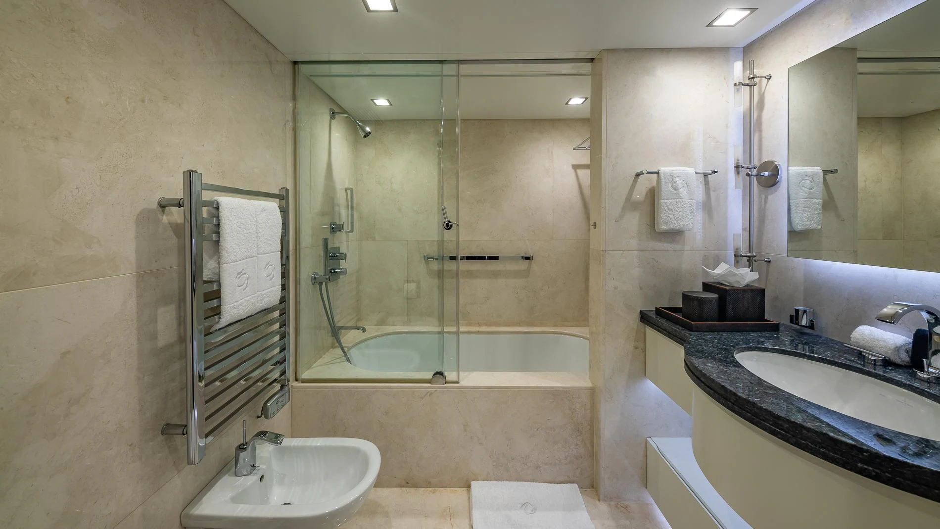 a bathroom with a glass shower aboard HOLDIN' MY OWN Yacht for Sale