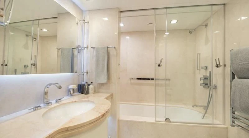 a bathroom with a shower and sink aboard HOLDIN' MY OWN Yacht for Sale