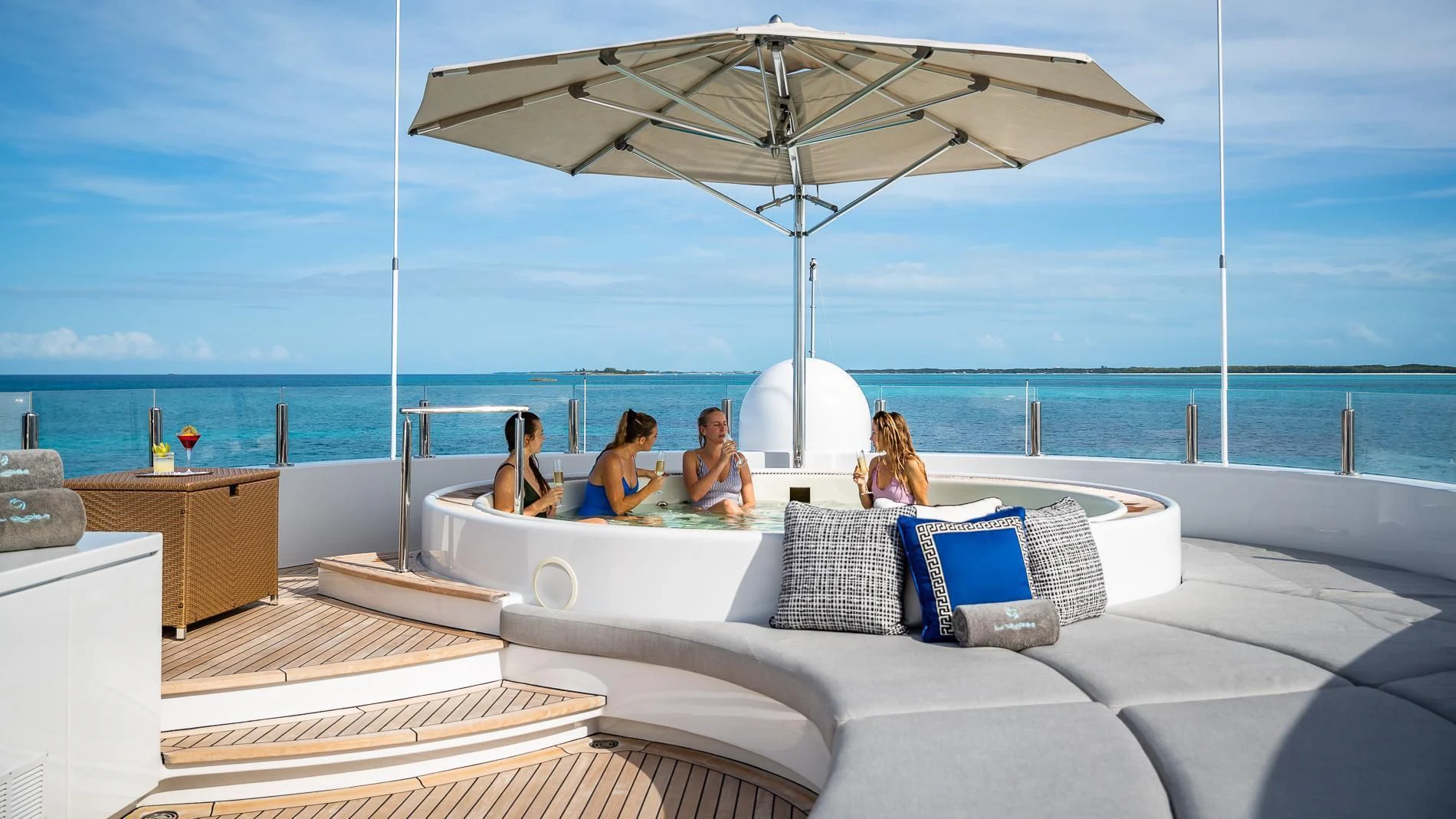 a group of people sitting on a couch on a beach aboard HOLDIN' MY OWN Yacht for Sale
