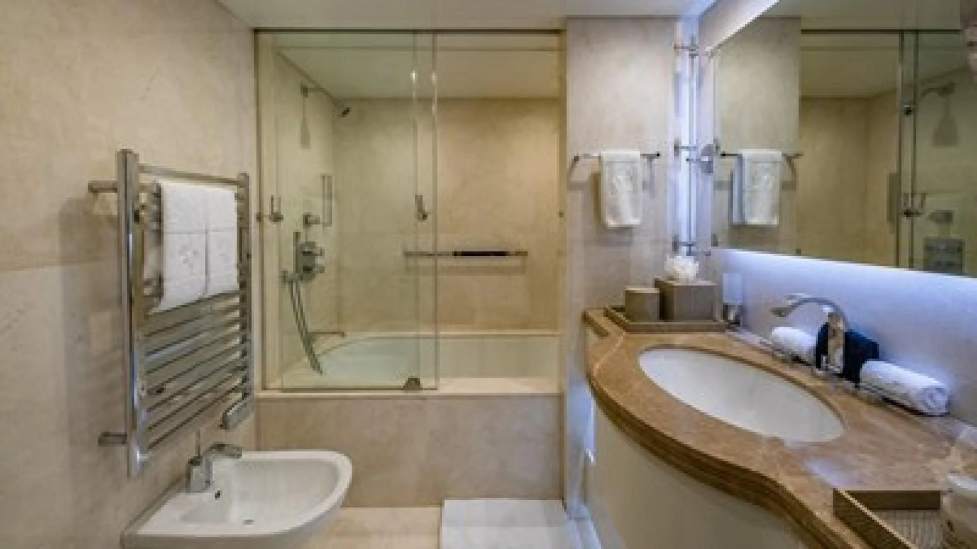 a bathroom with a sink and a bathtub aboard HOLDIN' MY OWN Yacht for Sale