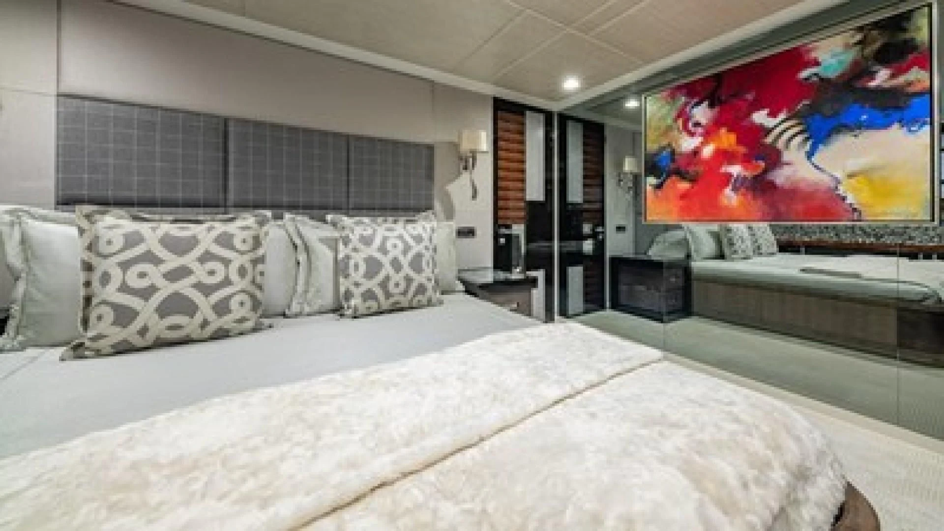 a large bed with a large painting above it aboard HOLDIN' MY OWN Yacht for Sale