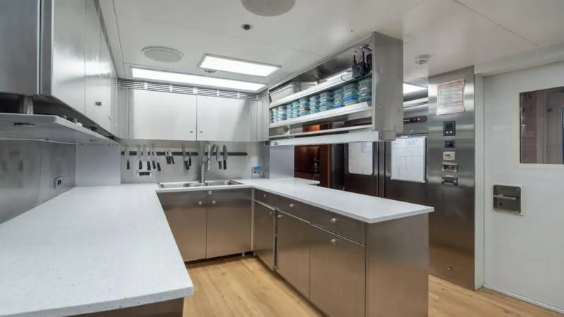 a kitchen with a large island aboard HOLDIN' MY OWN Yacht for Sale