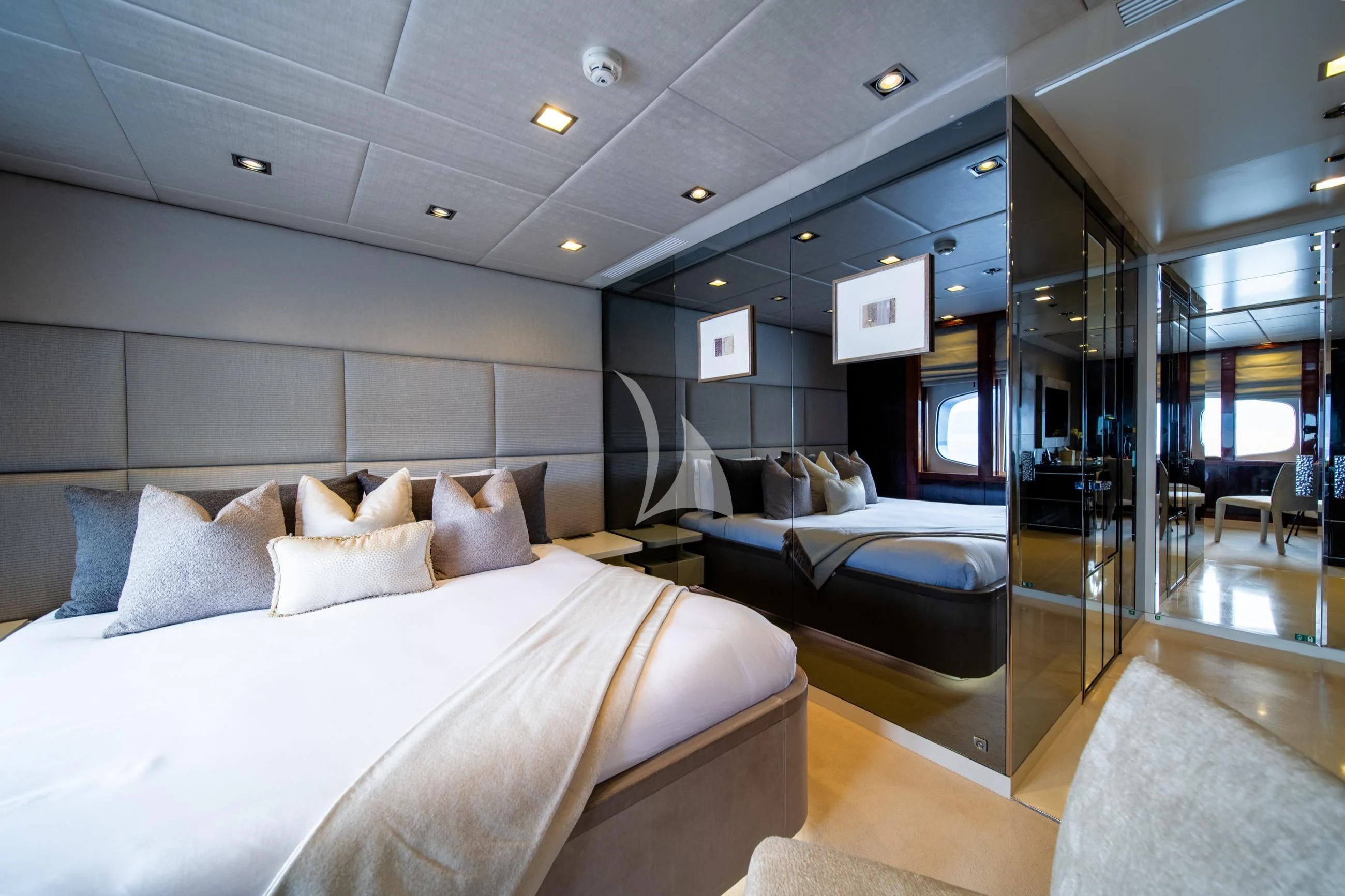 a bedroom with a bed and a large mirror aboard HOLDIN' MY OWN Yacht for Sale