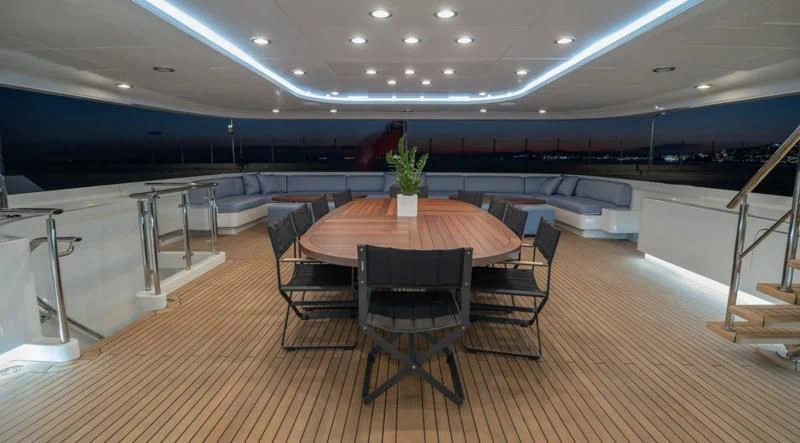 a room with a table and chairs aboard HOLDIN' MY OWN Yacht for Sale