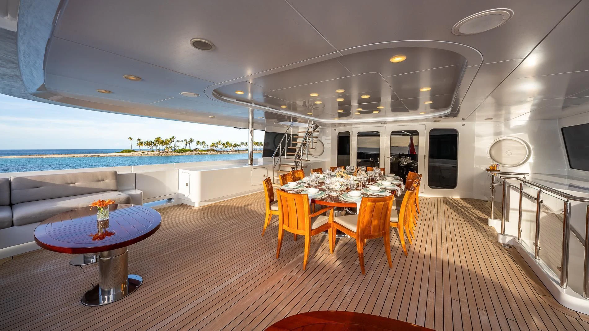 a large living room with a table and chairs aboard HOLDIN' MY OWN Yacht for Sale