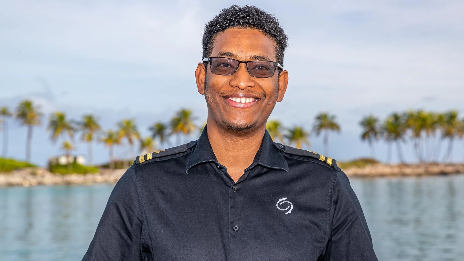 a man wearing glasses aboard HOLDIN' MY OWN Yacht for Sale