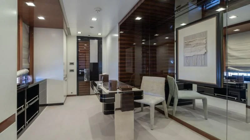 a room with chairs and a table aboard HOLDIN' MY OWN Yacht for Sale