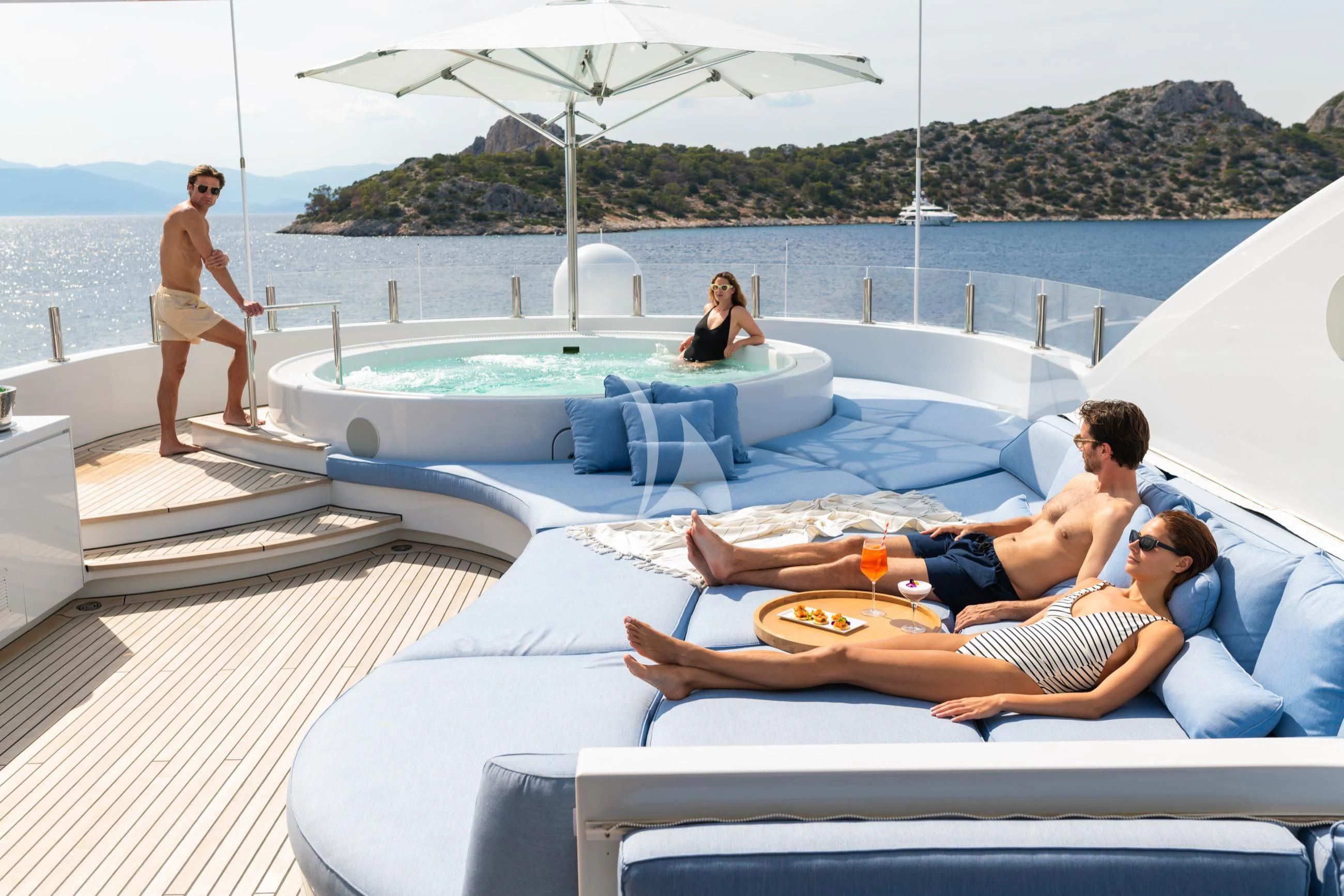a group of people sitting on a lounge chair on a boat aboard HOLDIN' MY OWN Yacht for Sale