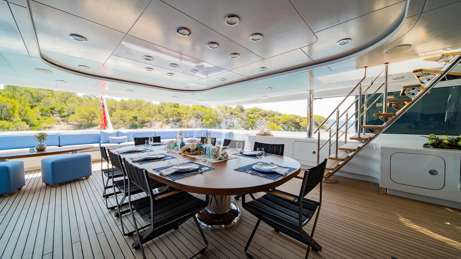 a dining room with a large table and chairs aboard HOLDIN' MY OWN Yacht for Sale