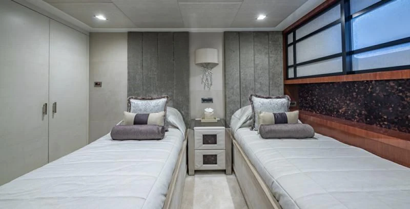 a room with a bed and a chair aboard HOLDIN' MY OWN Yacht for Sale