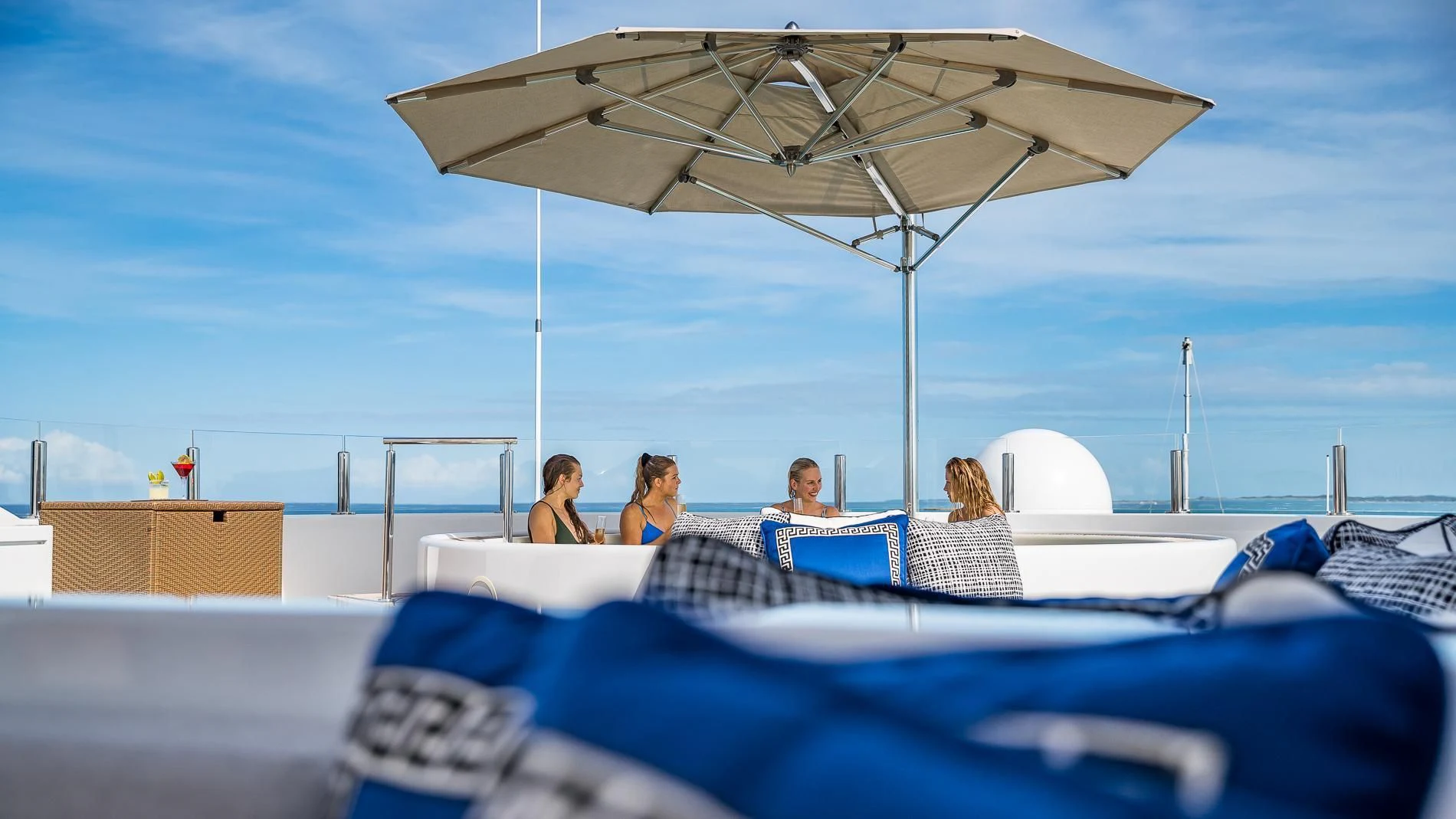 people sitting on a lounge chair under an umbrella aboard HOLDIN' MY OWN Yacht for Sale