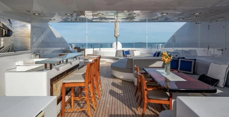 a room with a table chairs and a window aboard HOLDIN' MY OWN Yacht for Sale