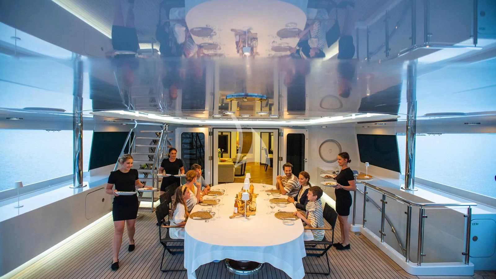 a group of people sitting at a table aboard HOLDIN' MY OWN Yacht for Sale