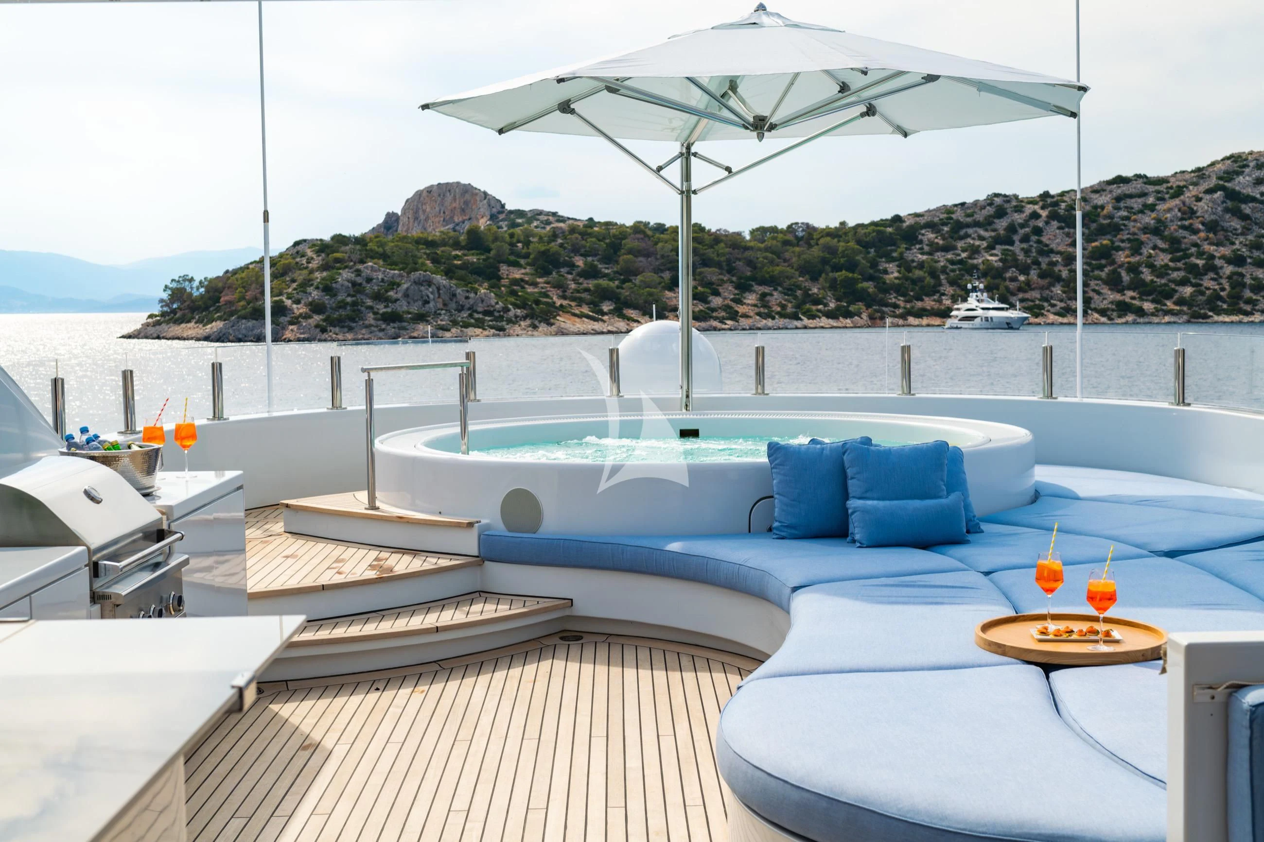 a pool with a table and umbrella aboard HOLDIN' MY OWN Yacht for Sale