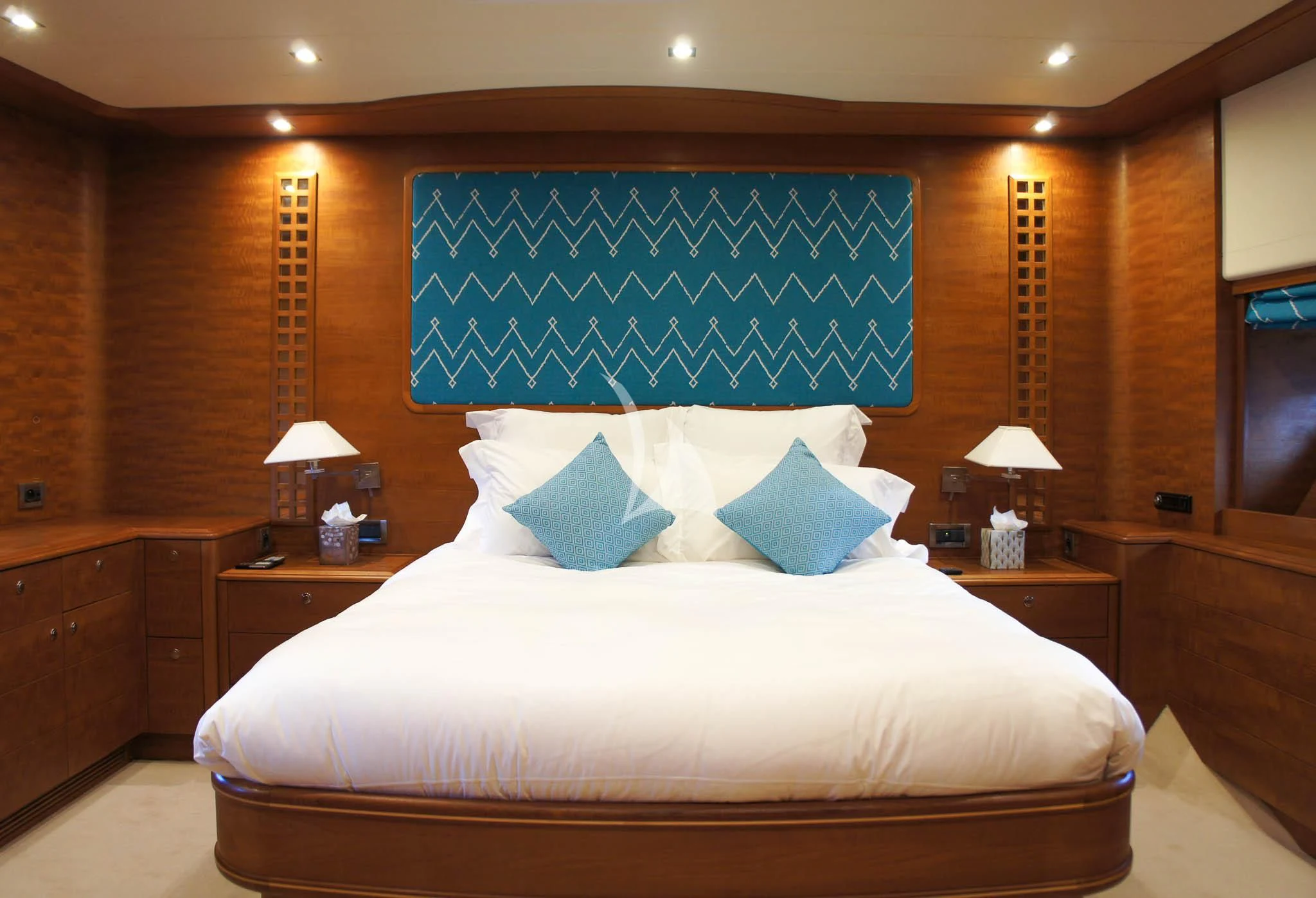 a bed with blue pillows aboard LADY EMMA Yacht for Sale