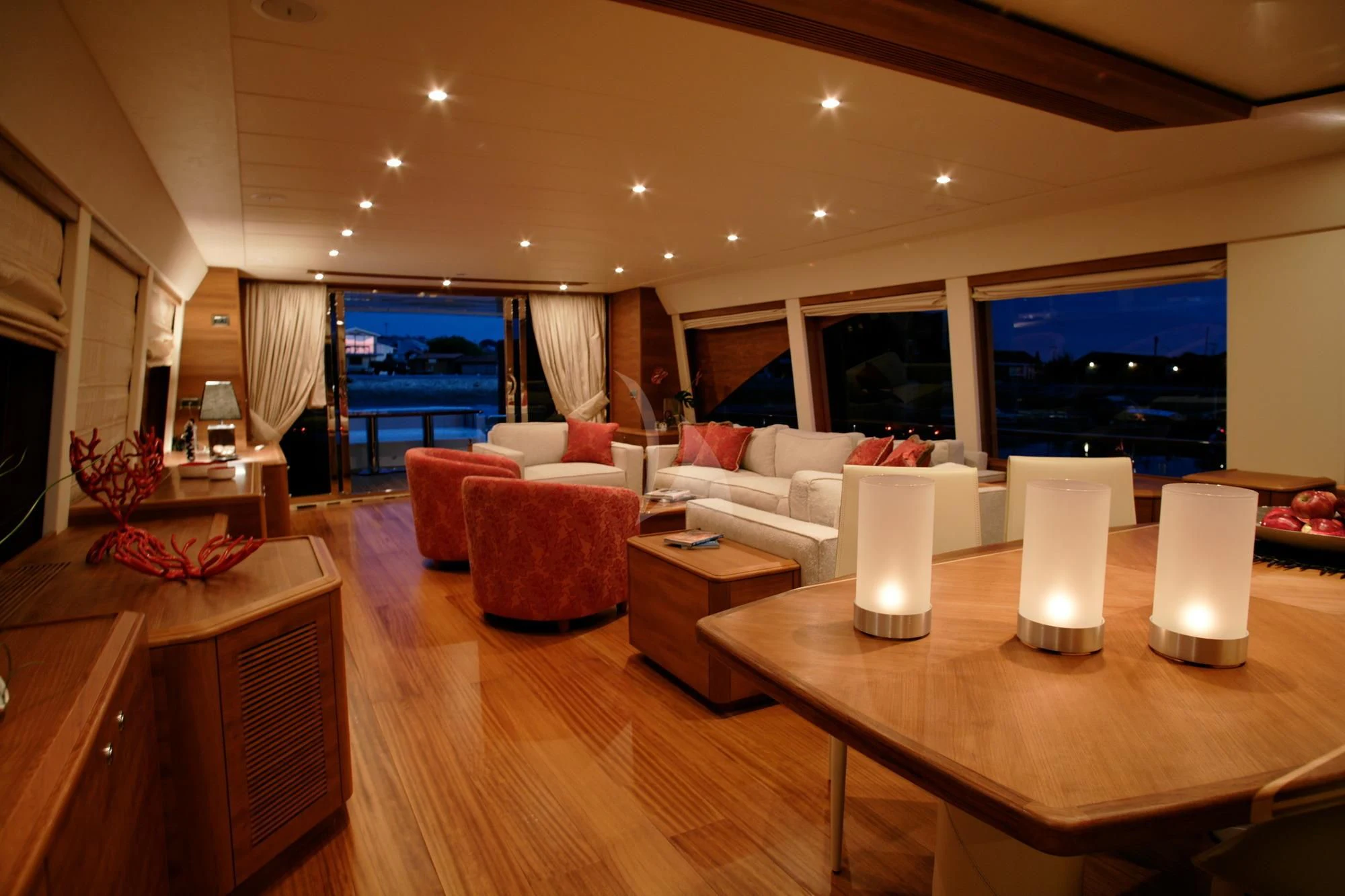 a living room with a large screen aboard LADY EMMA Yacht for Sale