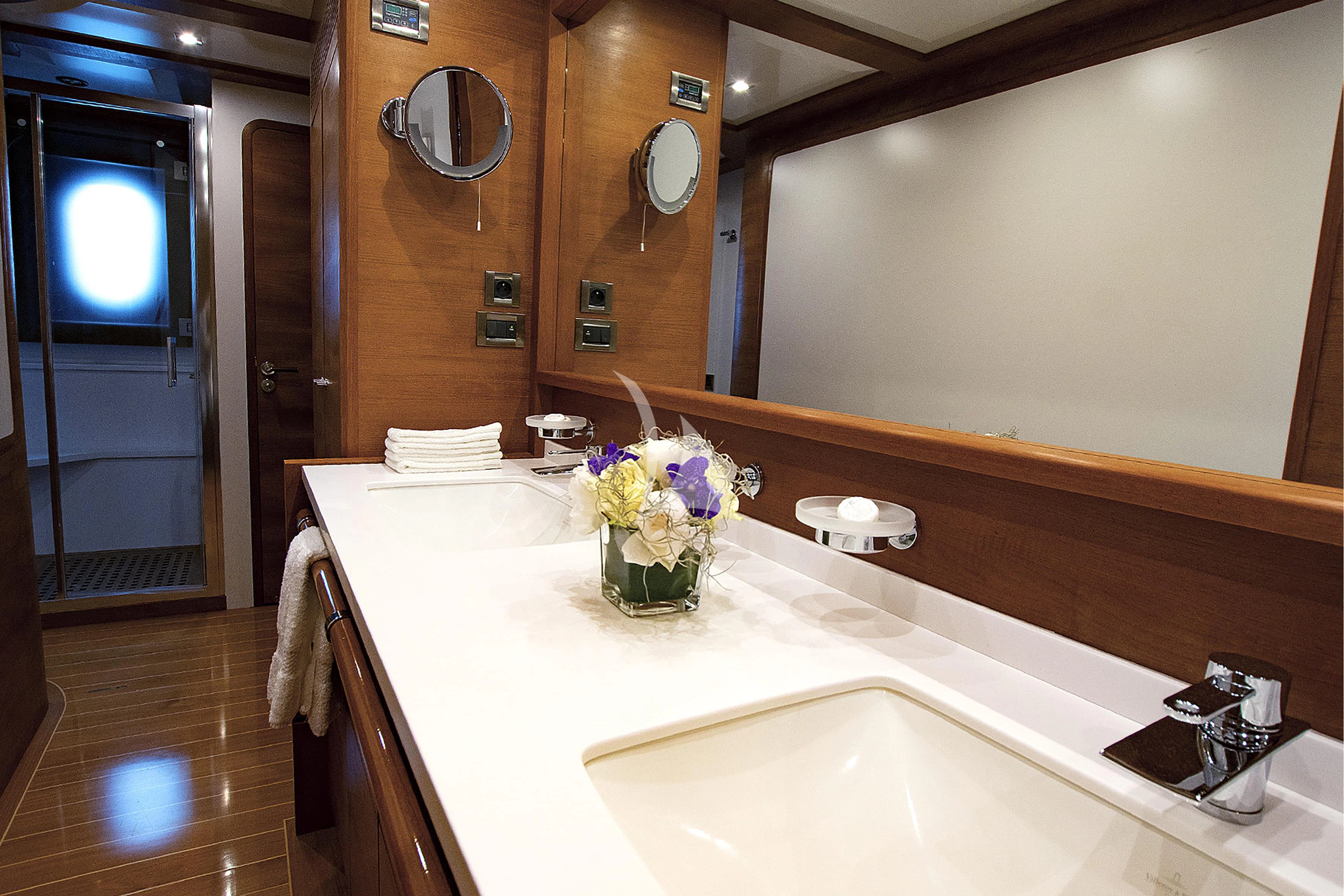 a bathroom with a sink and a mirror aboard LADY EMMA Yacht for Sale