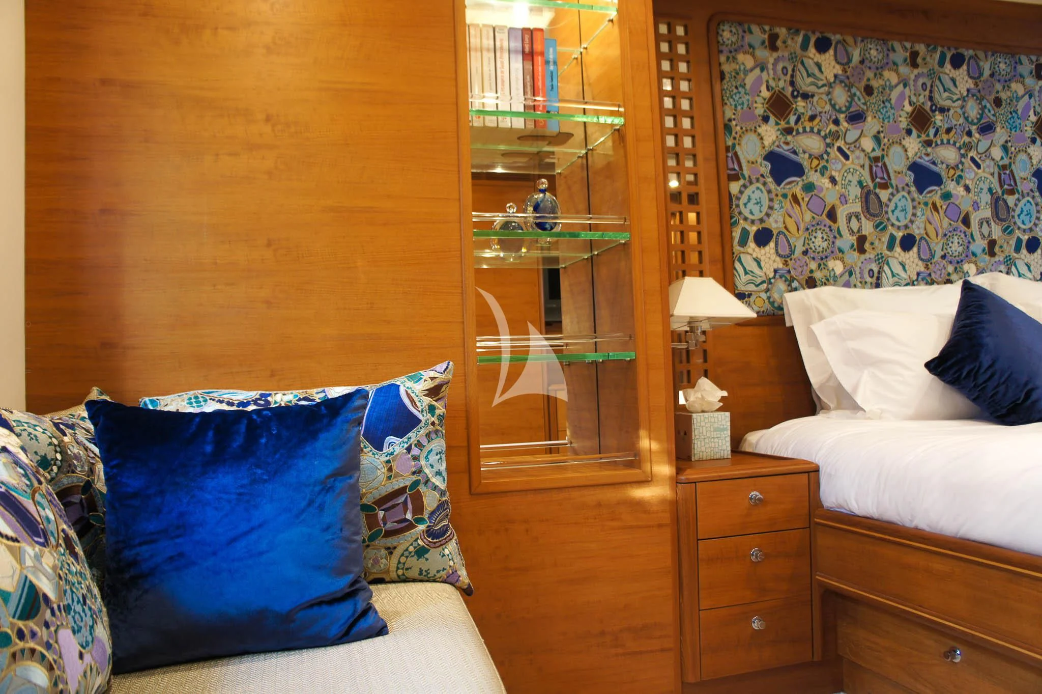 a bedroom with a bed and a book shelf aboard LADY EMMA Yacht for Sale