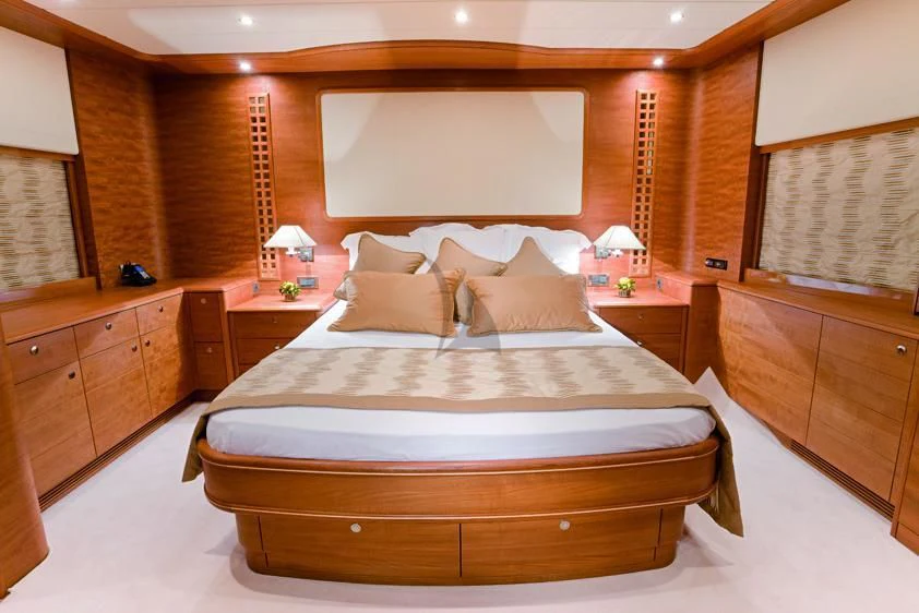 a large bed in a room aboard LADY EMMA Yacht for Sale
