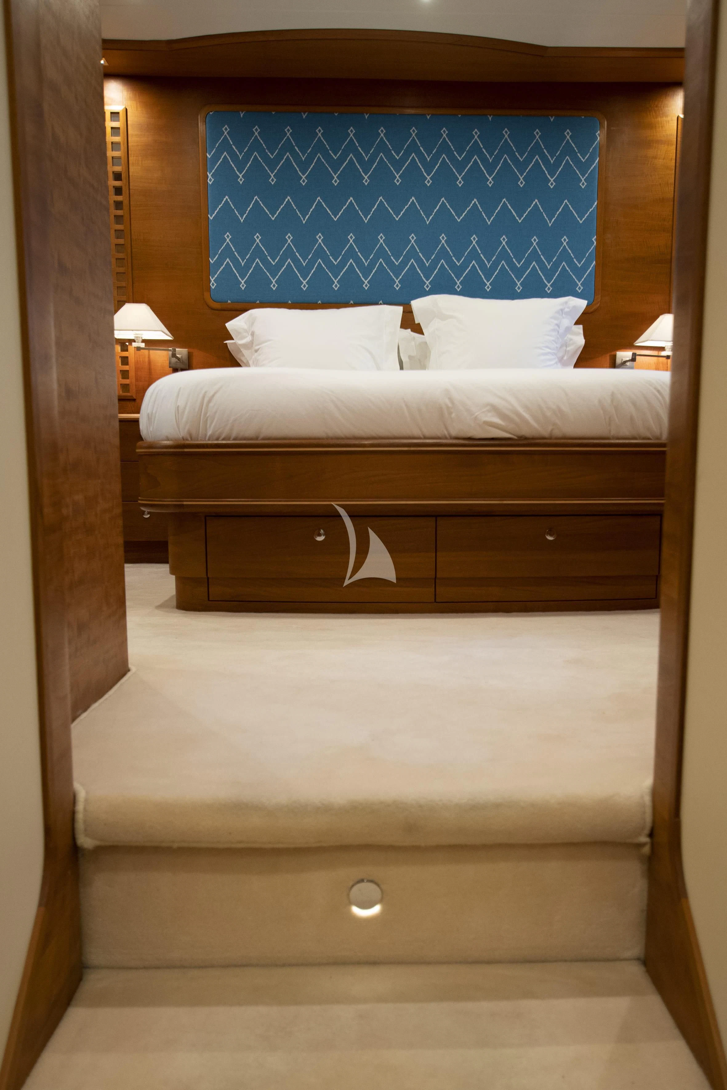 a bed with white sheets aboard LADY EMMA Yacht for Sale