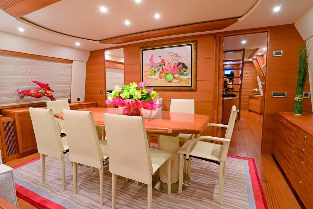 a room with tables and chairs aboard LADY EMMA Yacht for Sale