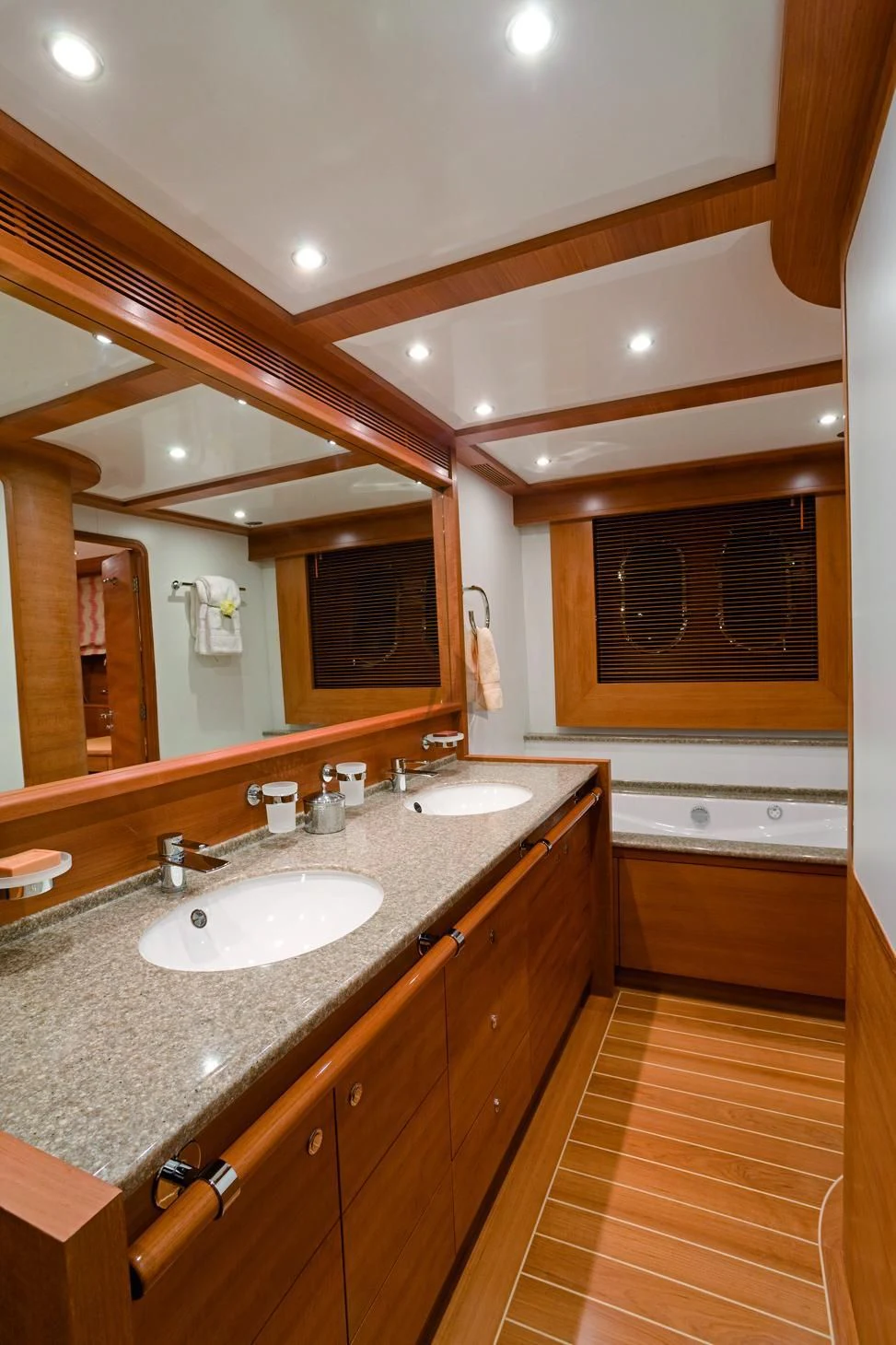 a bathroom with a large mirror aboard LADY EMMA Yacht for Sale