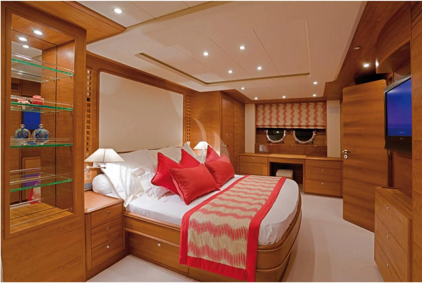 a bedroom with a bed and a tv aboard LADY EMMA Yacht for Sale