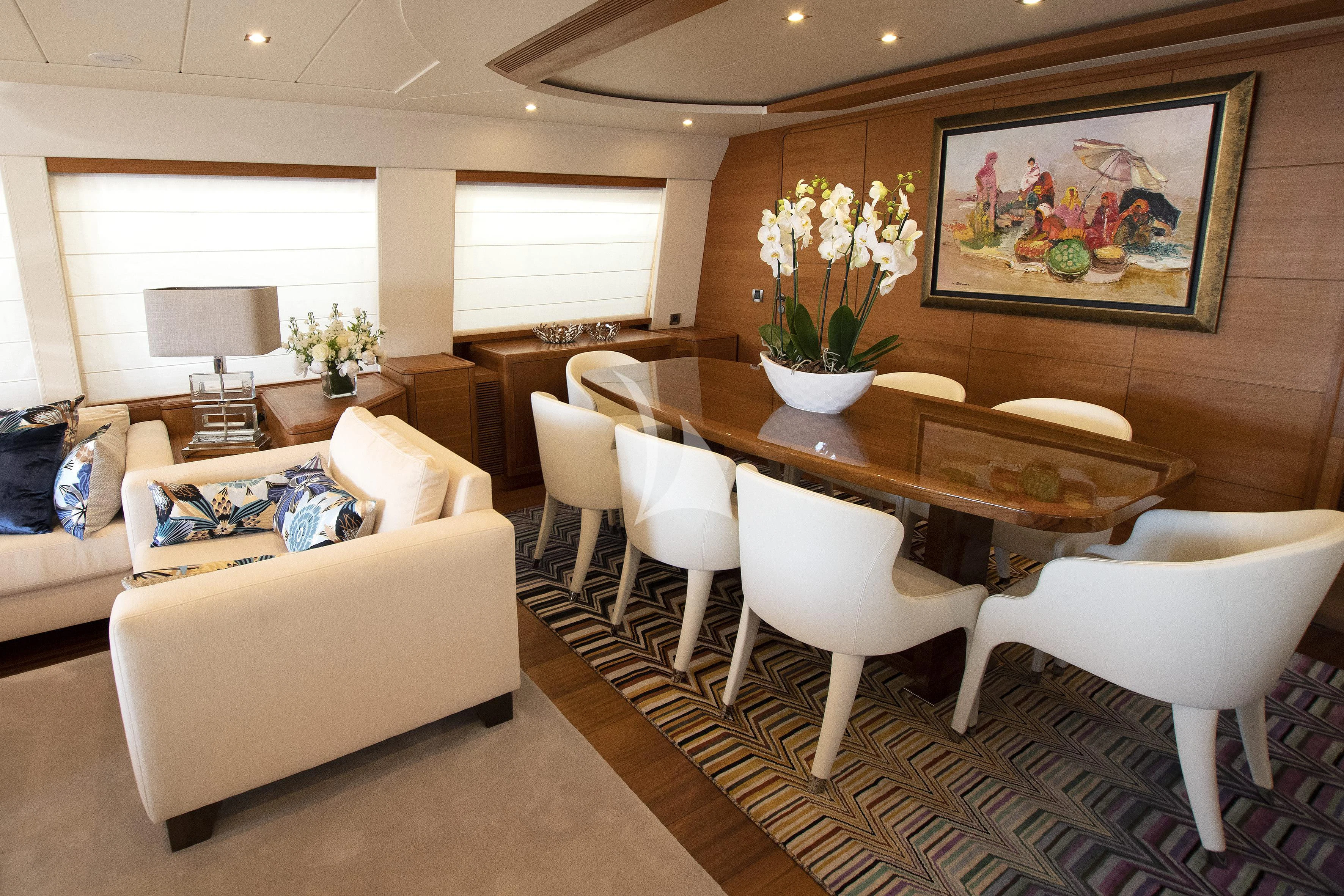 a living room with a table and chairs aboard LADY EMMA Yacht for Sale