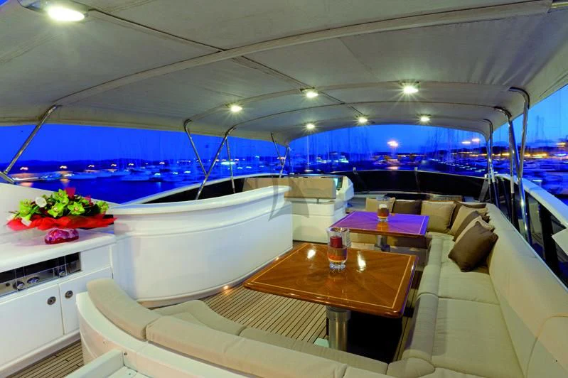 a room with a table and chairs aboard LADY EMMA Yacht for Sale