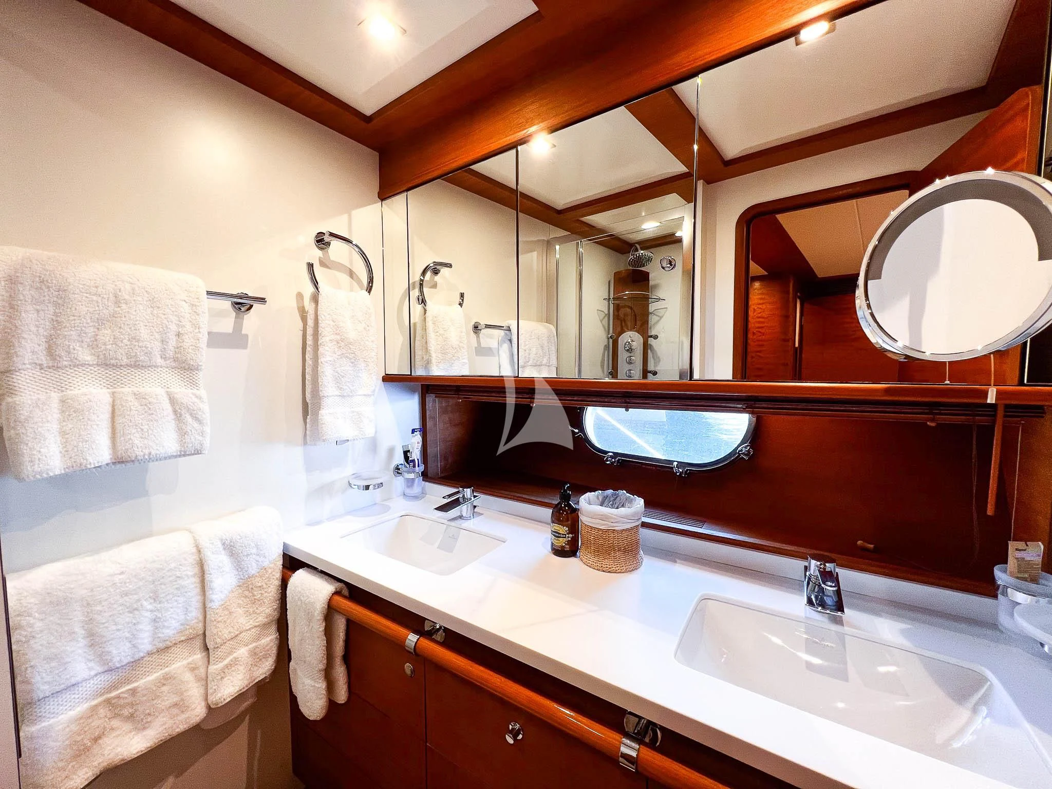 a bathroom with two sinks and a large mirror aboard LADY EMMA Yacht for Sale