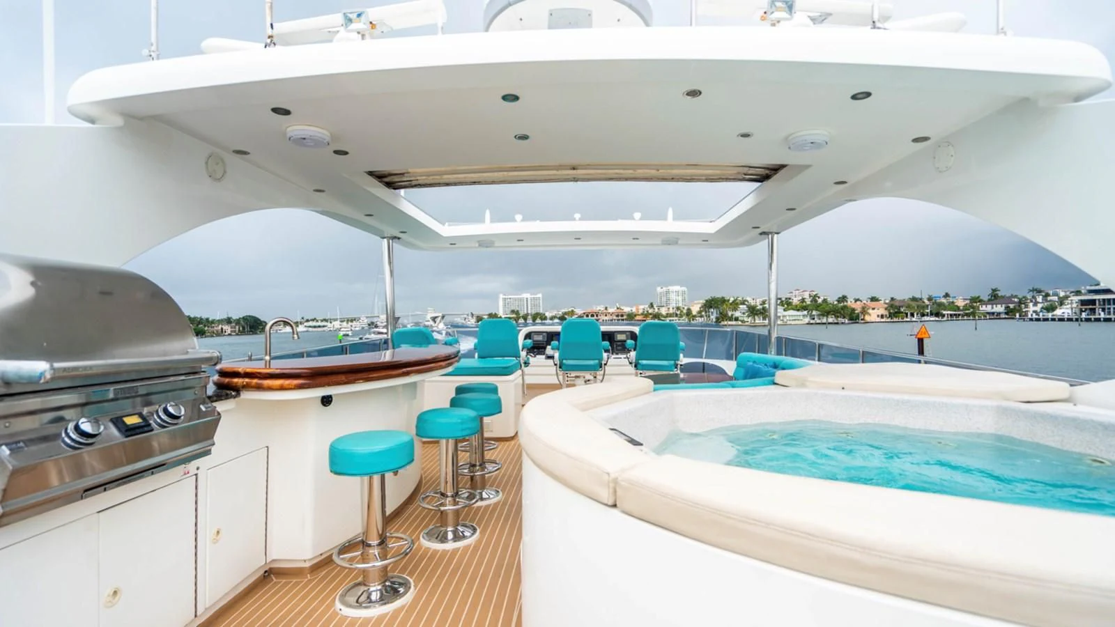 a large white boat with a pool aboard DREAM ON Yacht for Sale